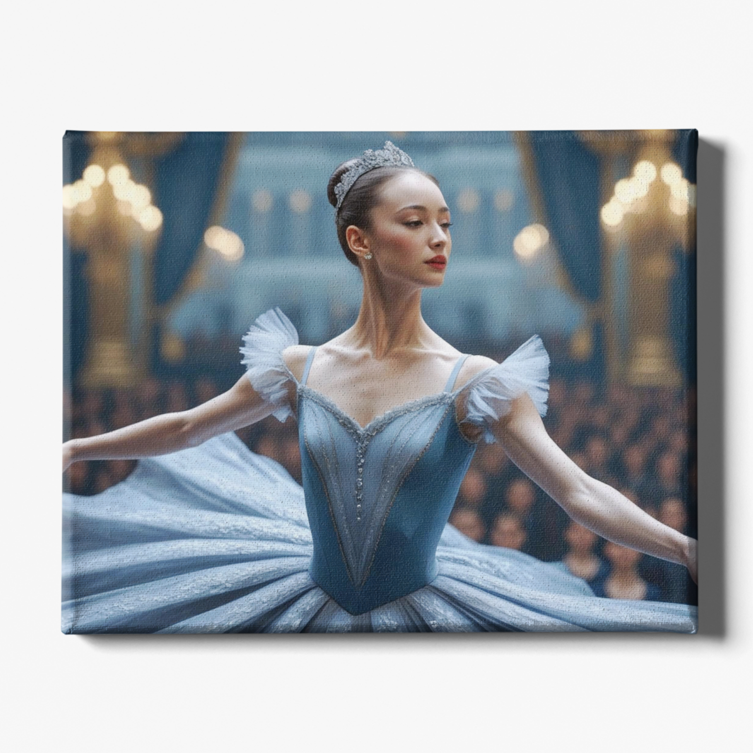 Ballerina in a blue costume with a tiara in a theater setting