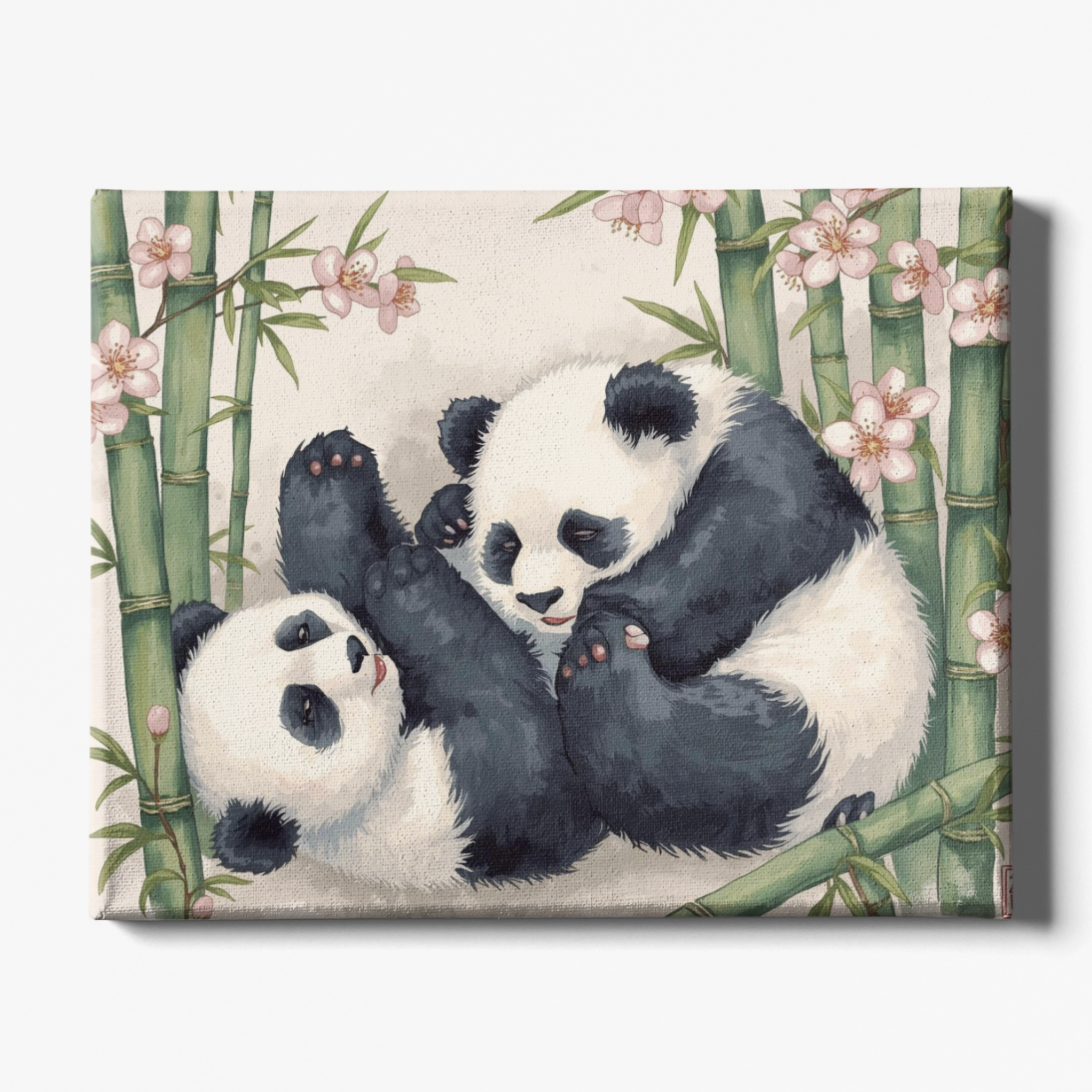 Two pandas playing among bamboo and flowers on a decorative mat.