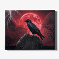 Canvas print with a black crow on a rock against a red moon and stormy sky.