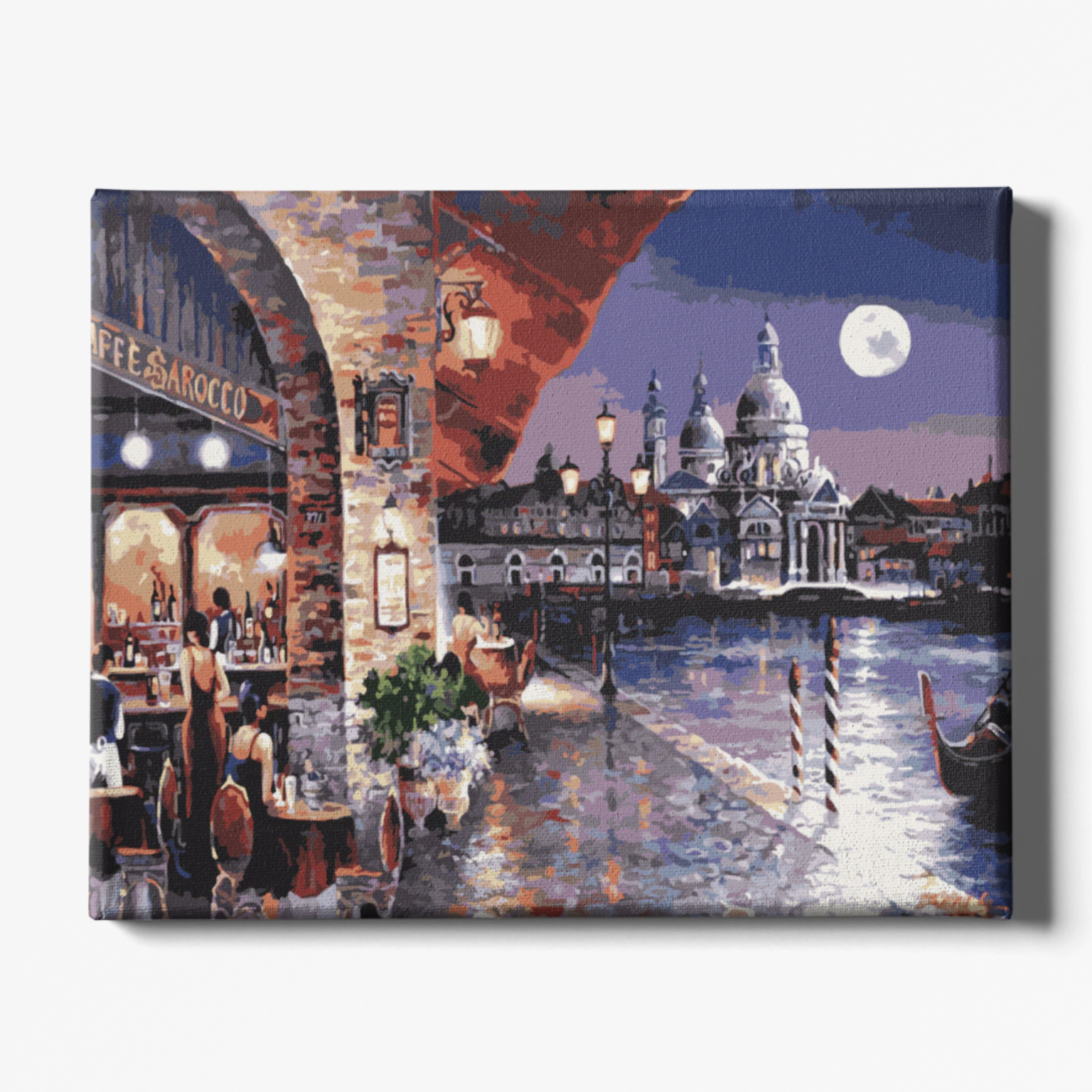Canvas print of a cityscape with a restaurant and a large building under a moonlit sky.