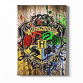 Hogwarts school crest on a wooden background with colorful splashes