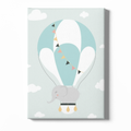 Canvas print with a cartoon elephant in a hot air balloon on a light blue background with white clouds.