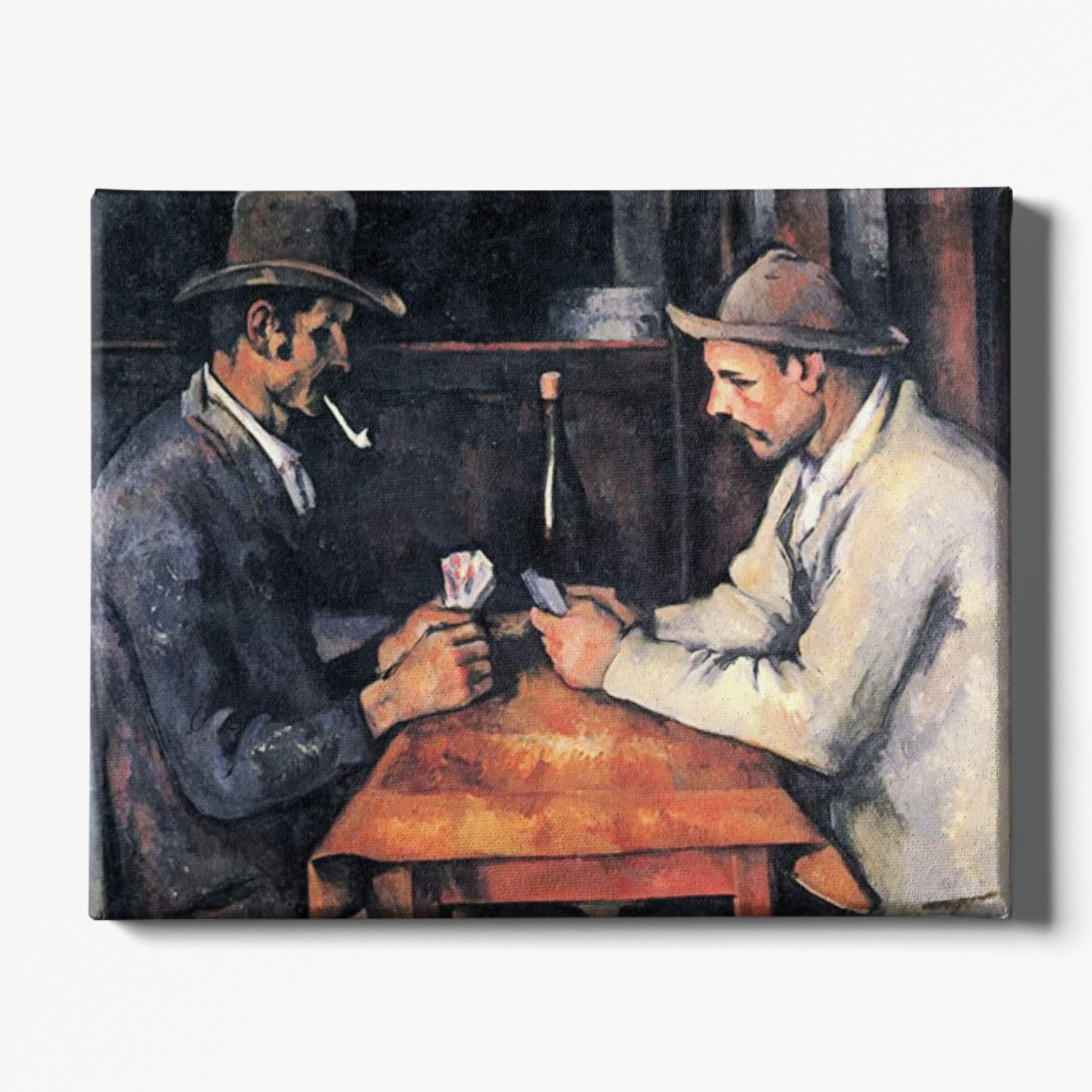 Two men playing cards at a table with a candle in the background, reminiscent of Cezanne's style.