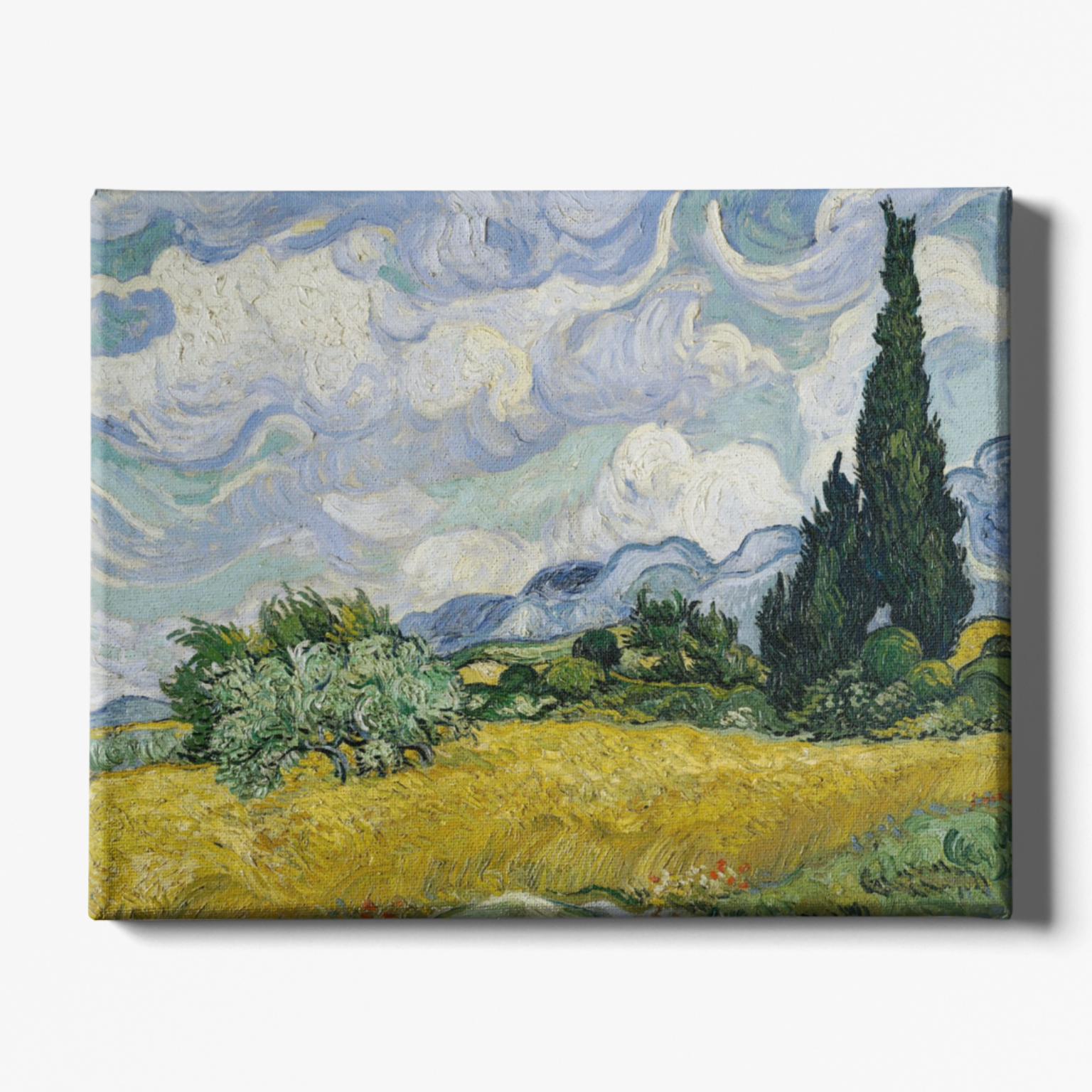 Canvas print of a landscape painting with a yellow field, green trees, and a blue sky.